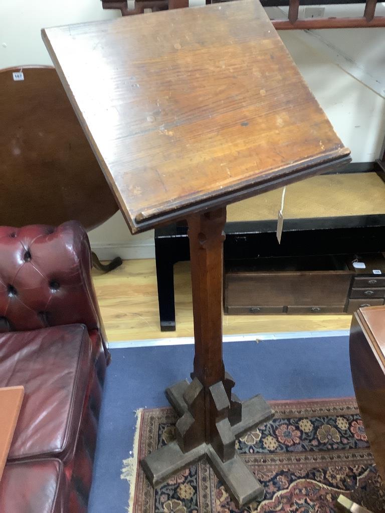 A Victorian pine Gothic style lectern, width 50cm height 139cm